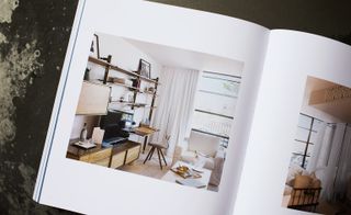 Book open at a page showing the Interiors of the Andre Fu-designed Villa La Coste hotel