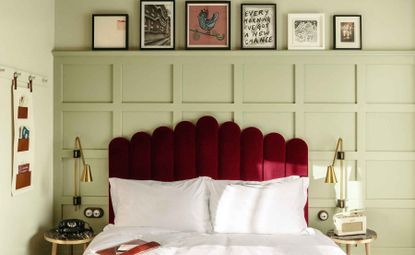 Bedroom featuring red headboard and retro-style furniture