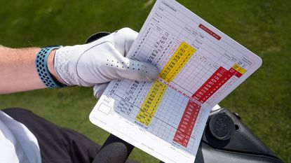 10 Golf Rules Myths, man signing card