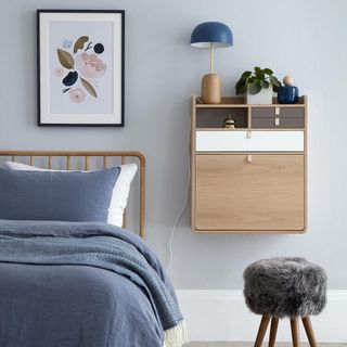 bedroom with frame on wall and bed