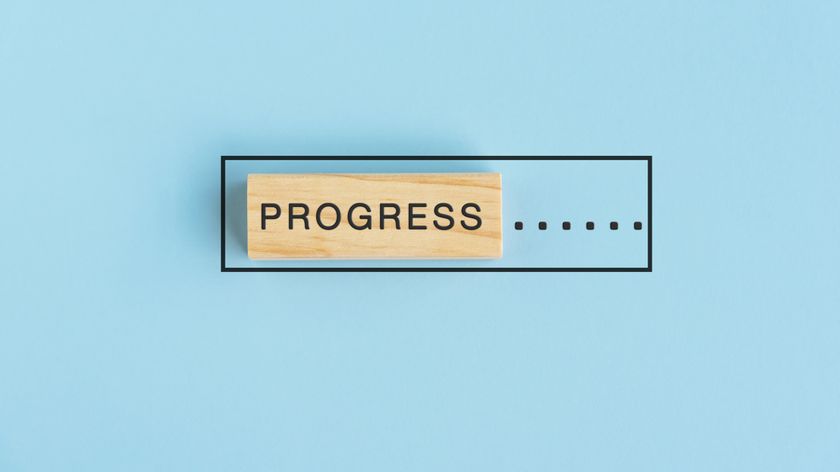 An artistic image where a digital progress bar is represented by a physical wooden block.