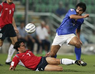 Italy's Gennaro Gattuso vies for the ball with Norway's captain Martin Sorensen in a qualifier in 2006.