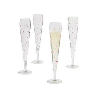 Champagne flutes with small red dots