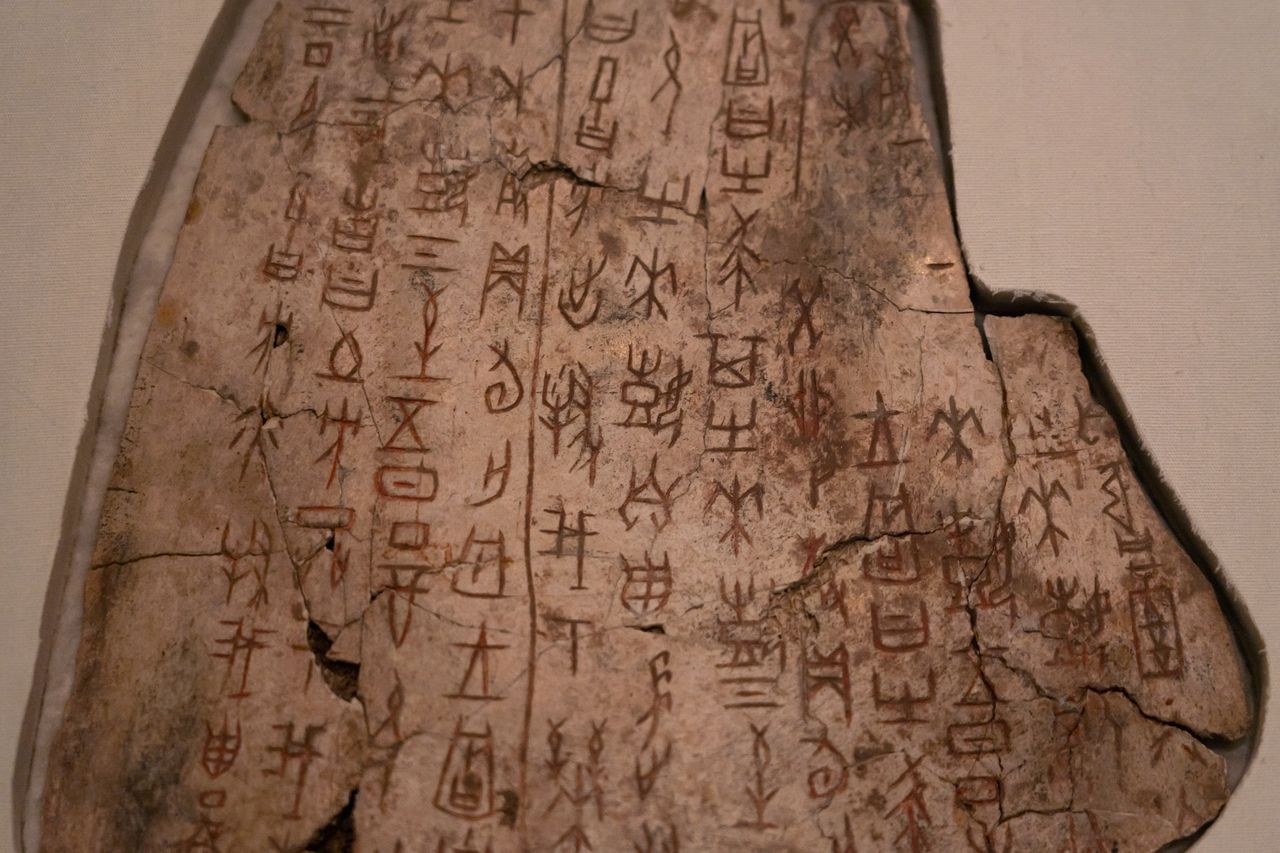 a scapula bone with early Chinese writing on it