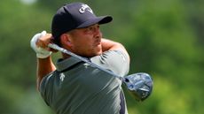 Xander Schauffele hits a driver
