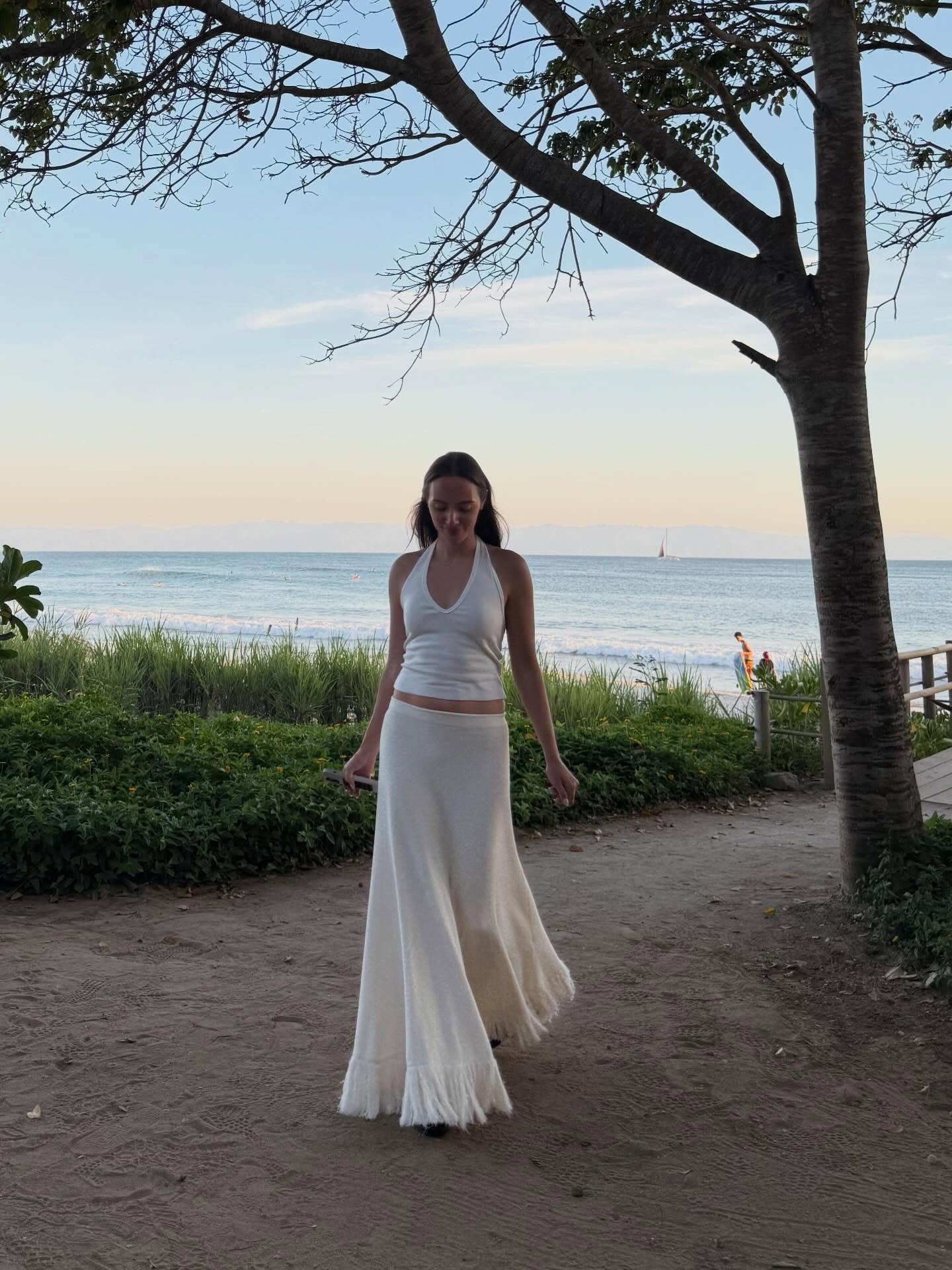 An image of a woman wearing best off white skirt for summer