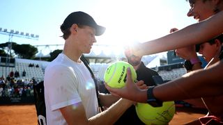Jannik Sinner of Italy signs autographs for fans following a training session on day two of the Internazionali BNL D'Italia 2025 in May 2025