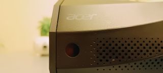 An Acer C250i projector sitting on a table