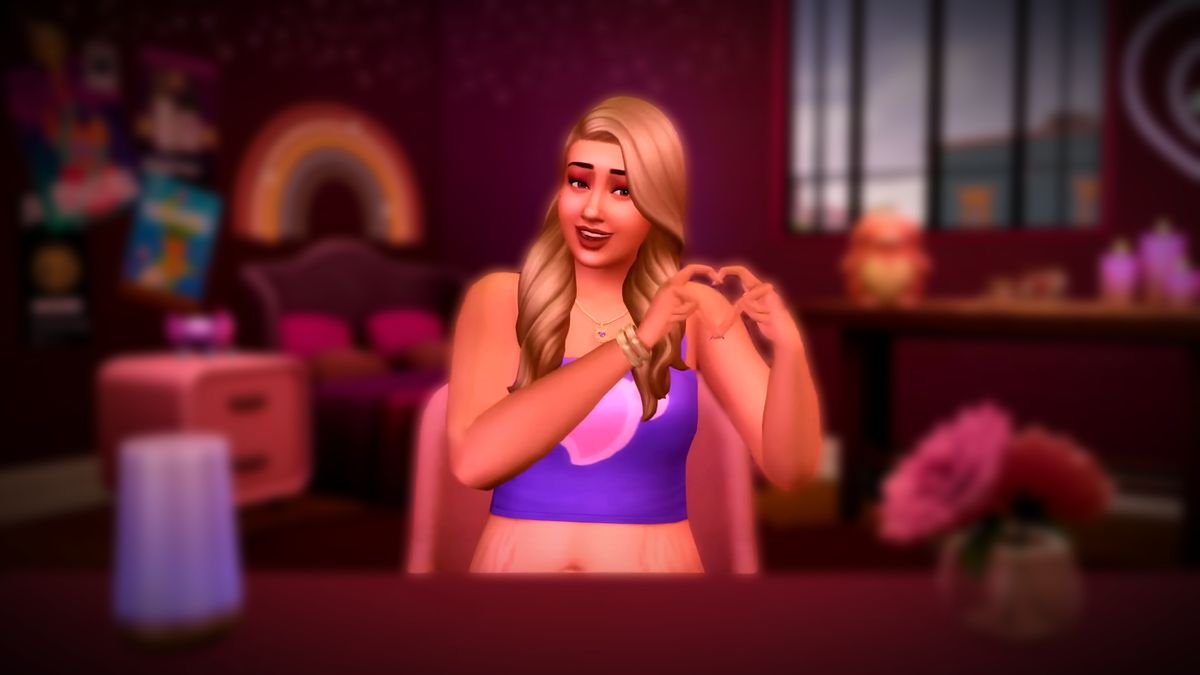 The Sims 4 Lovestruck gameplay trailer screenshot showing a blonde woman with long hair and a purple crop top making a heart with her two hands while smiling