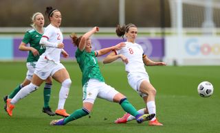 Marissa Callaghan of Northern Ireland tackles England's Jill Scott