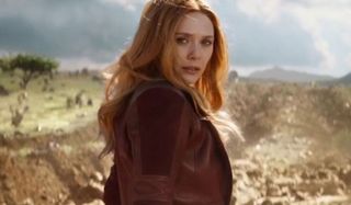 Elizabeth Olsen as Wanda, looking over her shoulder intently.