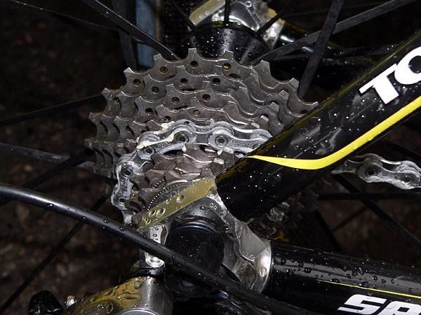 When the rain comes down, team mechanics crack out the grease for the chains.