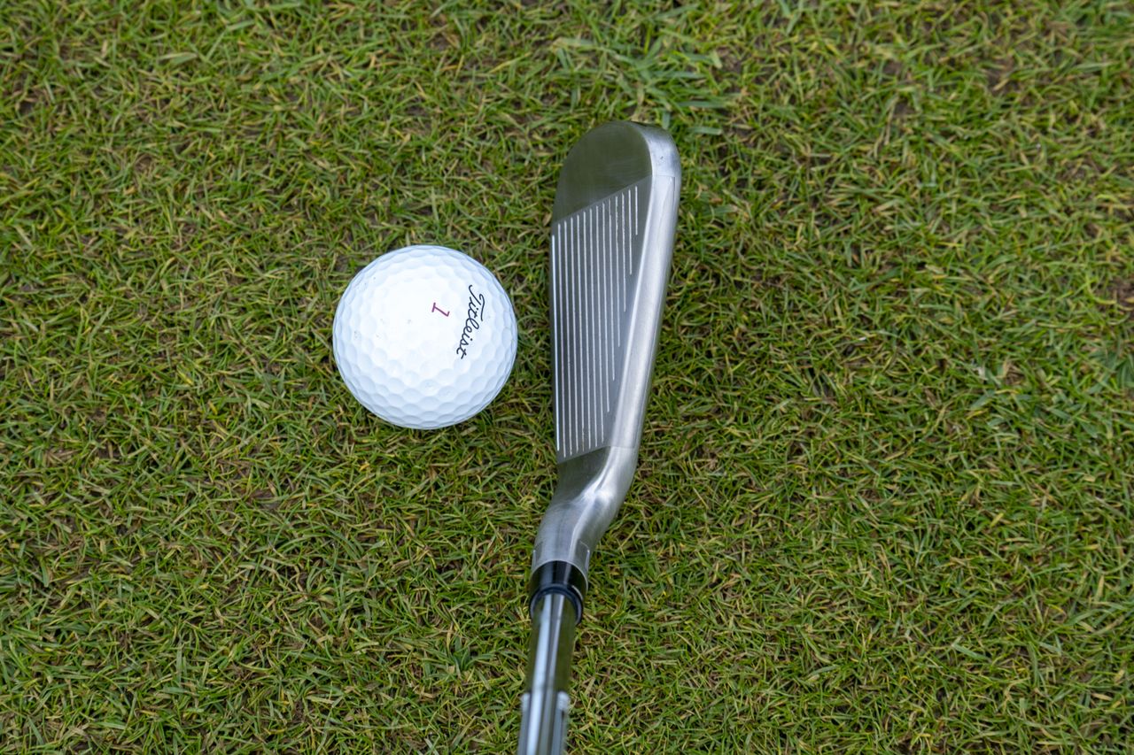 Stealth iron behind ball