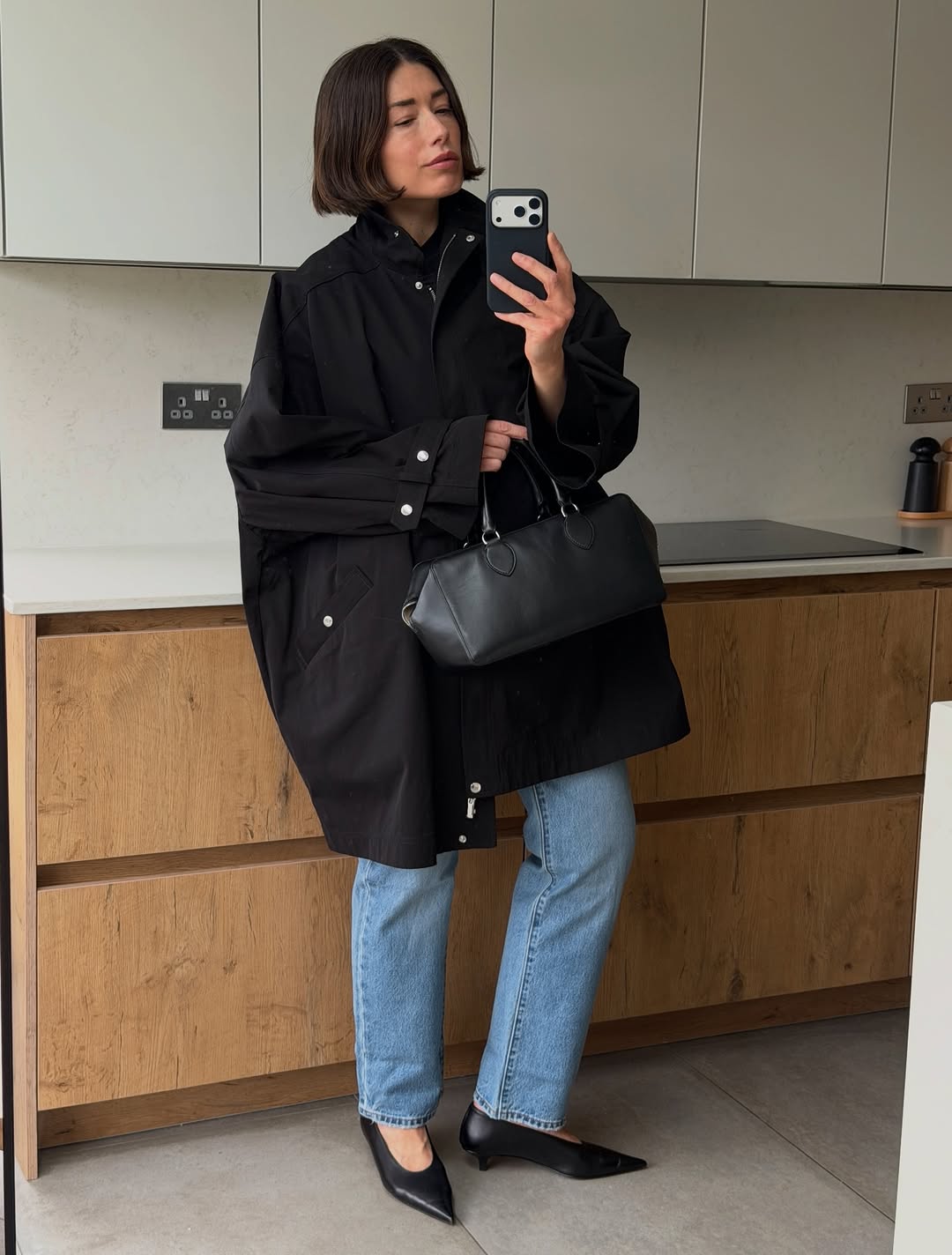 woman wearing heels with jeans spring outfit 2026