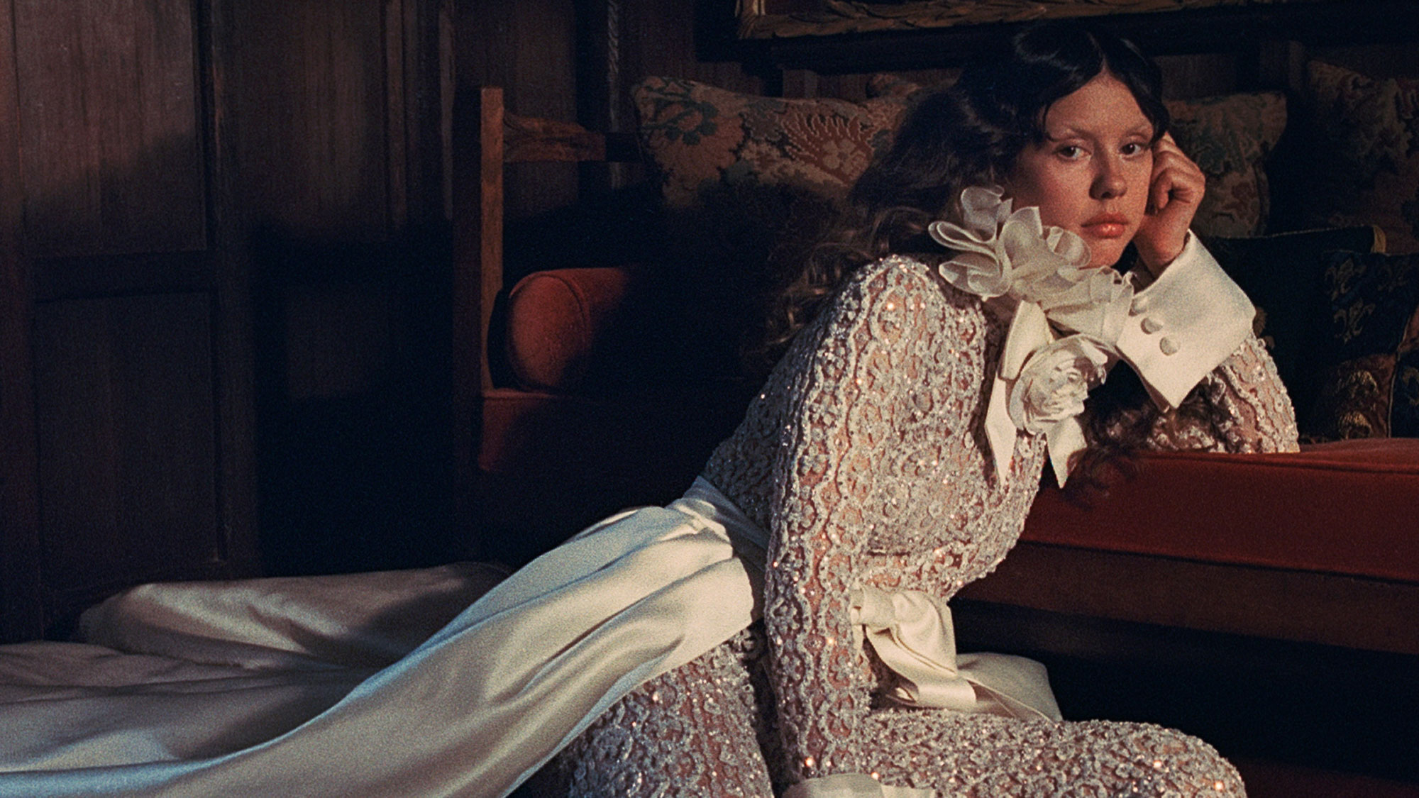 Mia Goth wears a white lace outfit in a shoot for Who What Wear