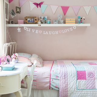 girl bedroom with pink wall and bed