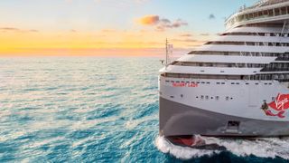 virgin cruise ship on the ocean at sunset