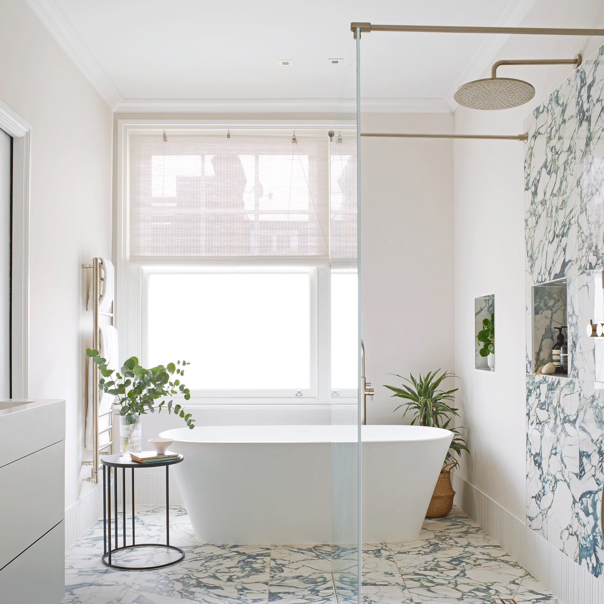 White bathroom with marble tiles