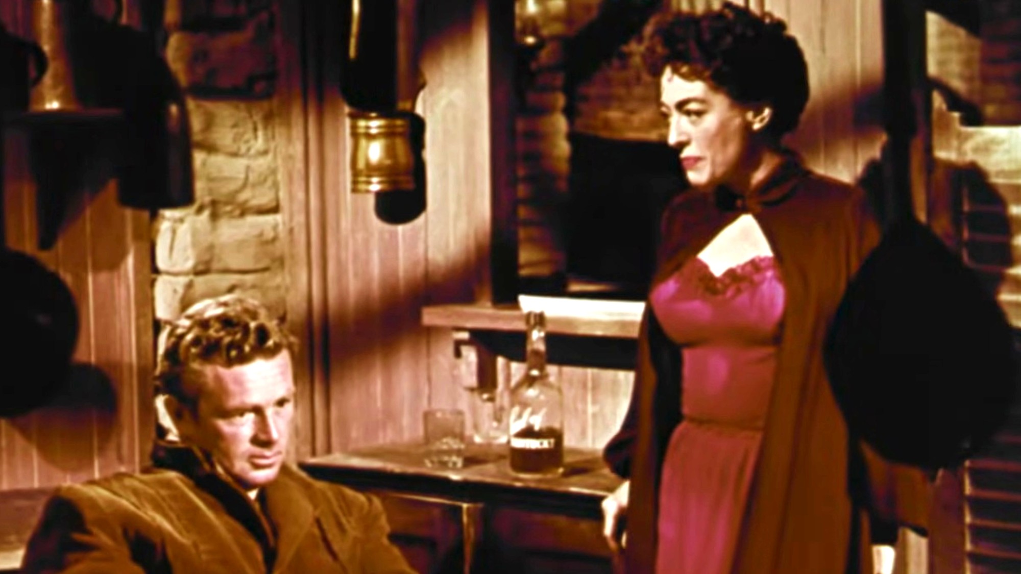 Joan Crawford having a stern discussion with Sterling Hayden in Johnny Guitar