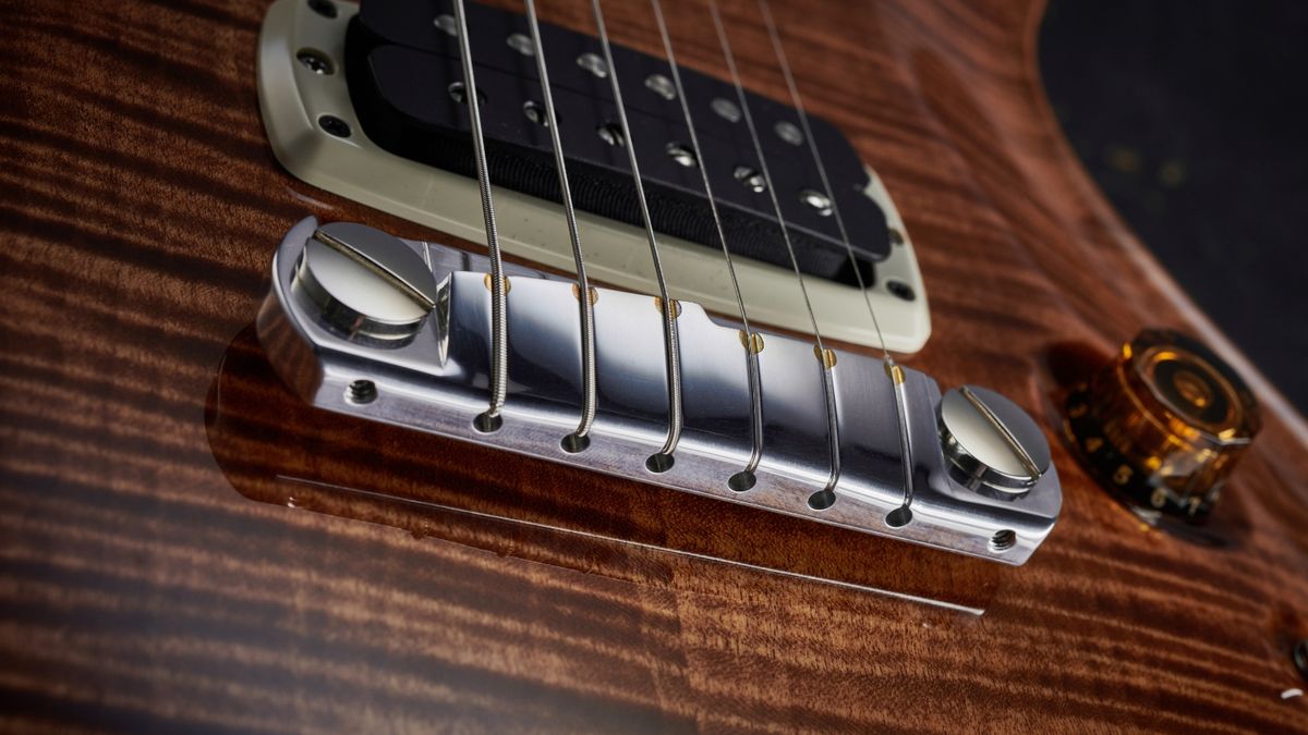 Close up of a wraparound guitar bridge