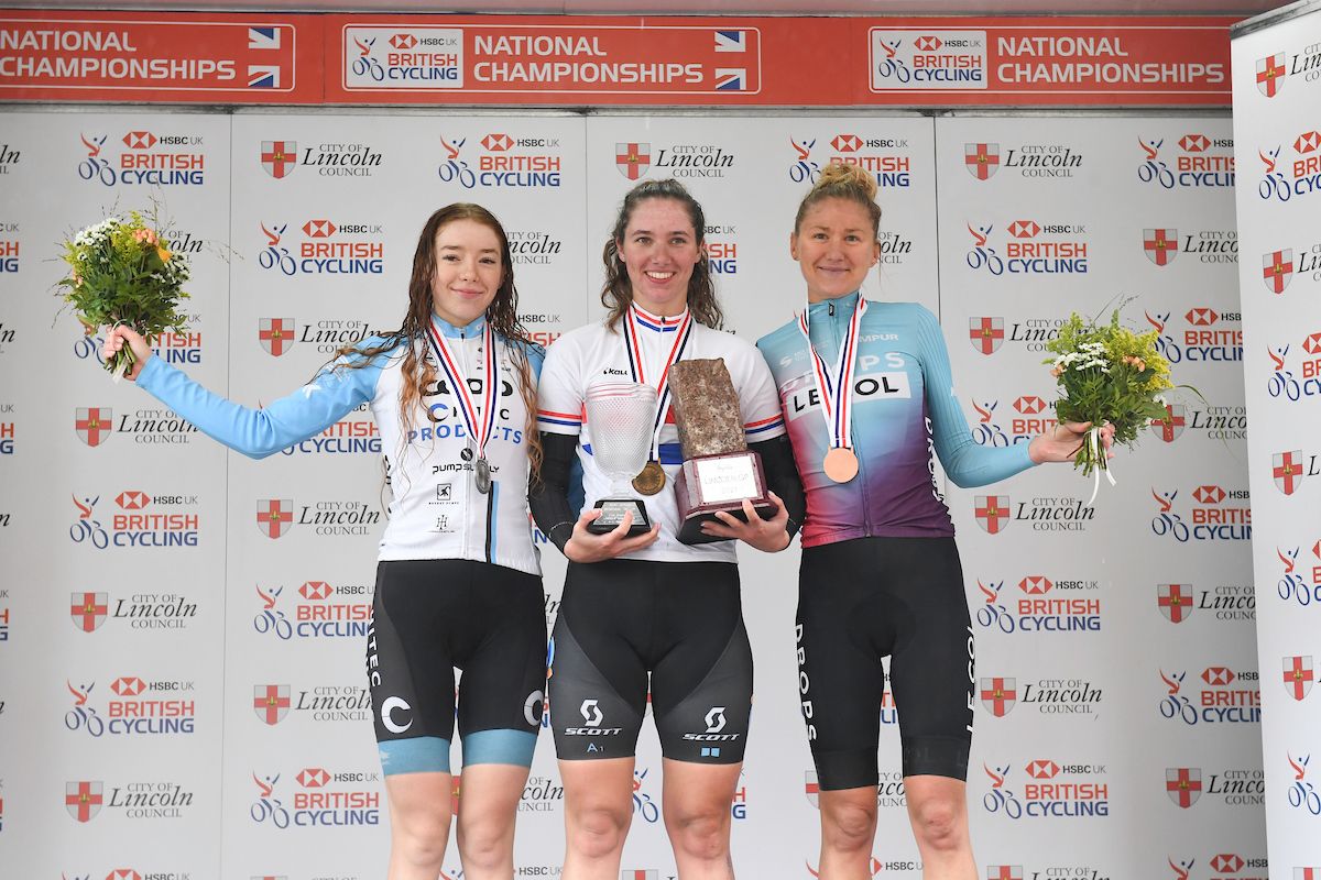 Picture by Simon Wilkinson/SWpix.com - 17/10/2021 - Cycling - Women's National Road Championships - Rapha Lincoln GP - Lincoln, England - Podium - DSM's Georgi Pfeiffer wins the Women's National Road Series championships at Lincoln with Team Coop-HiTec Product's Josie Nelson finishing second and Drops-Le Col's Joss Lowden finishing third.