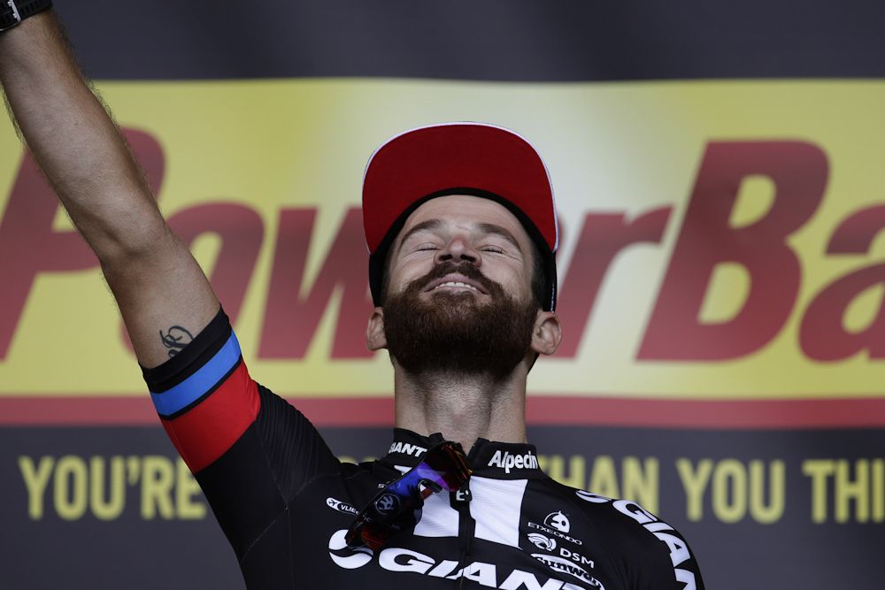 Simon Geschke enjoys his time on the stage 17 podium.