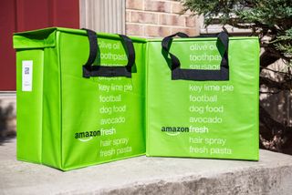 Amazon Fresh bags shown on doorstep