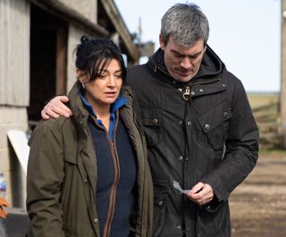 Moira is comforted by Cain Dingle