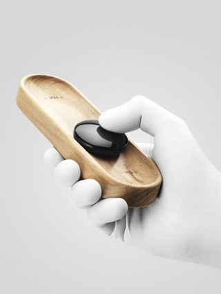 Hardwood base and sliding black-stone controller that's attached magnetically