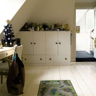 childrens room with elm desk and white painted floors