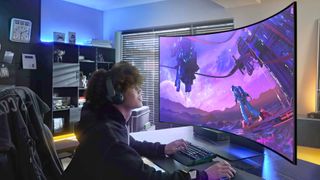 Player using Samsung Odyssey Ark with mouse and keyboard at desk