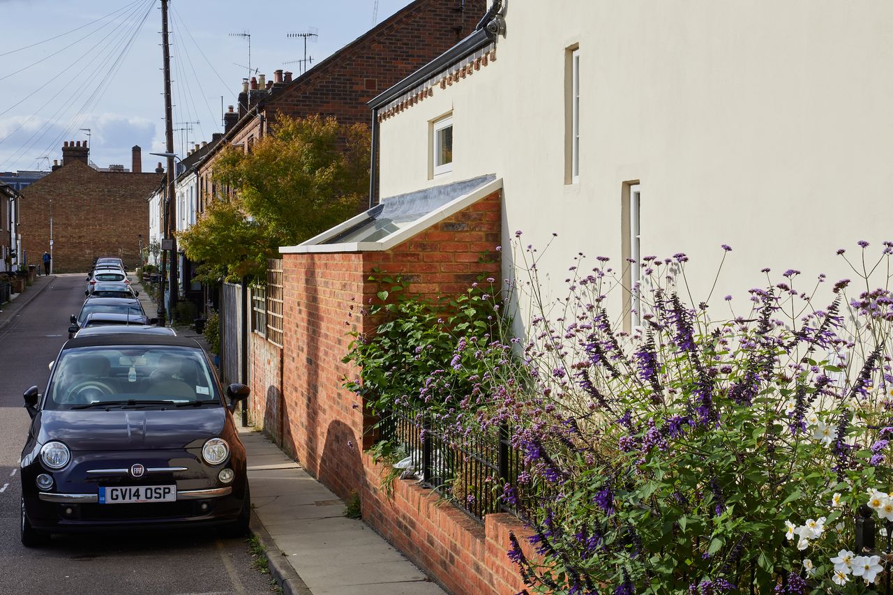 small brick extension to side of rendered house