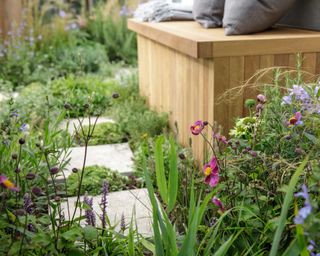 paving and plants at 'Green Sky Pocket Garden' designed by James Smith at rhs chelsea flower show 2021