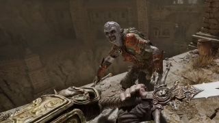 Swinging a sword at a gray-skinned monster standing too close to a sheer drop