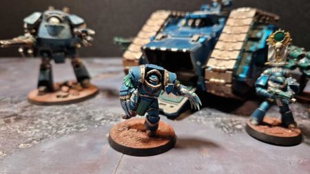 A Terminator charges out of a Spartan tank.