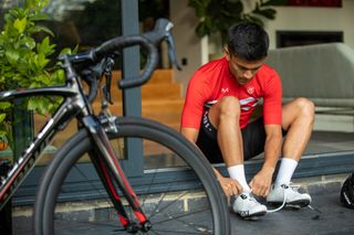 Image shows someones feet in cycling shoes