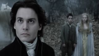 Johnny Depp as Ichabod Crane with others in the woods in Sleepy Hollow