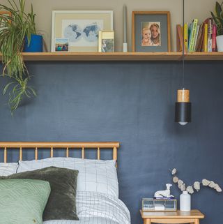 Blue and neutral bedroom with a shelf