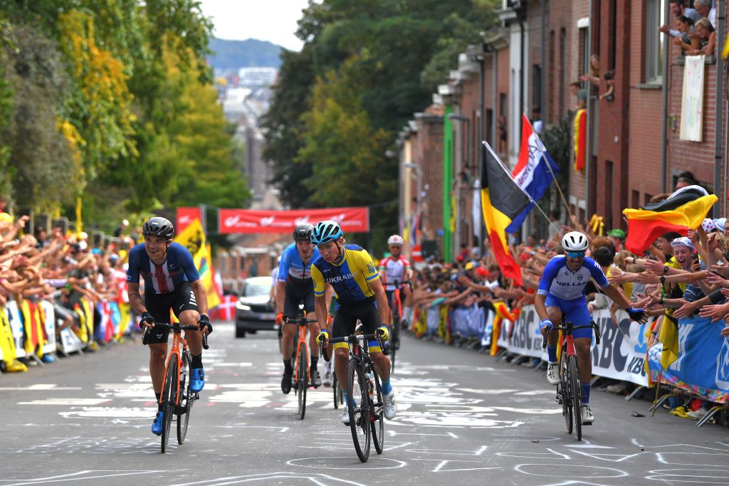 LEUVEN BELGIUM SEPTEMBER 26 LR Robin Carpenter of The United States Anatolii Budiak of Ukraine and Polychronis Tzortzakis of Greece compete during the 94th UCI Road World Championships 2021 Men Elite Road Race a 2683km race from Antwerp to Leuven flanders2021 on September 26 2021 in Leuven Belgium Photo by Luc ClaessenGetty Images