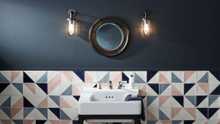 bathroom with blue walls and wall lights