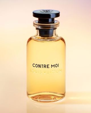 Bottle of contre moi perfume against a light yellow background