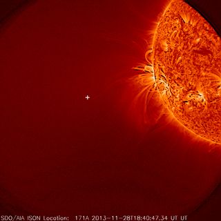 This image from NASA's Solar Dynamics Observatory shows the sun, but no Comet ISON was seen. A white plus sign shows where the Comet should have appeared after its sun flyby on Nov. 28, 2013.