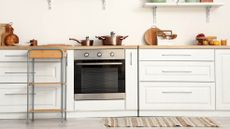 Silver oven in beige colored kitchen