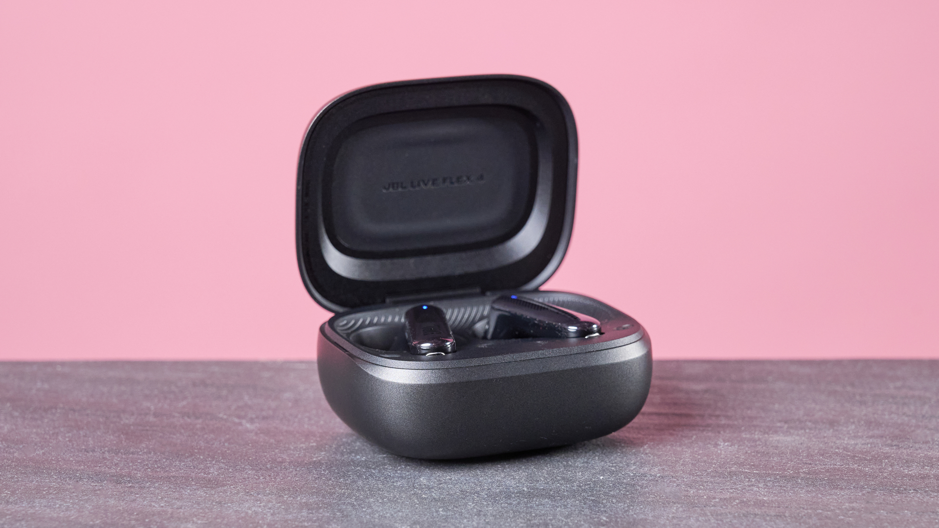 JBL Live Flex 4 on table with charging case open