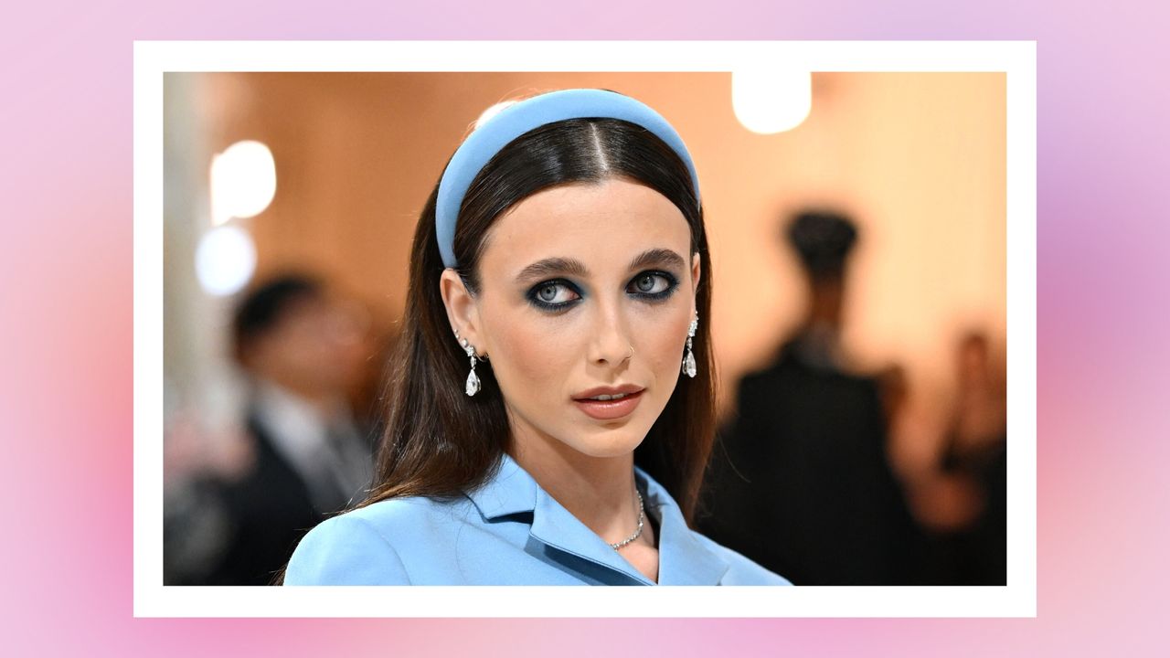 Emma Chamberlain wears a blue top and headband, as well as nude lipstick as she arrives for the 2023 Met Gala at the Metropolitan Museum of Art on May 1, 2023, in New York. - The Gala raises money for the Metropolitan Museum of Art&#039;s Costume Institute. The Gala&#039;s 2023 theme is &quot;Karl Lagerfeld: A Line of Beauty.&quot; / in a pink/purple template