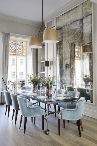 grand dining room with large mirror in townhouse by Sims Hilditch