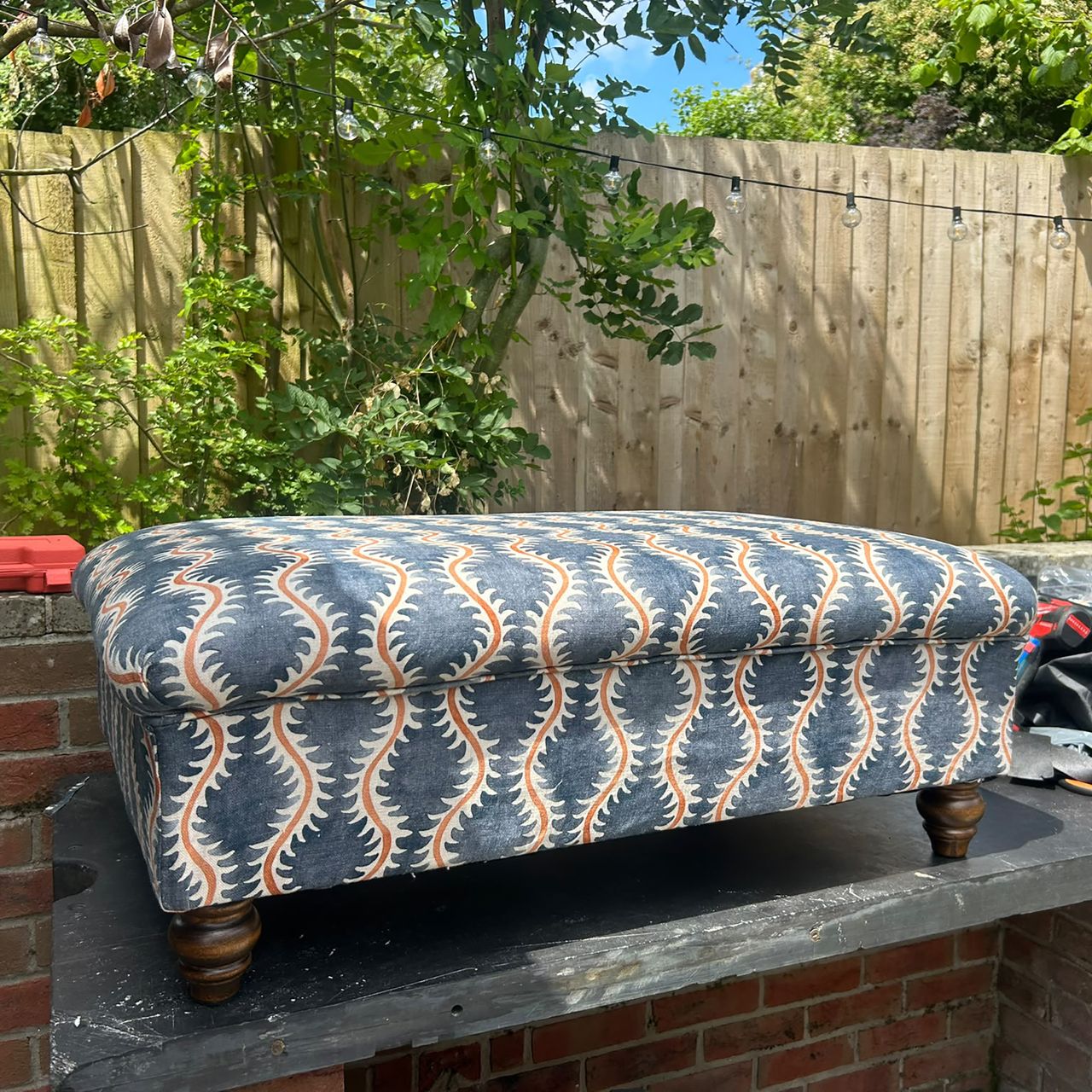 Upholstered footstool before and after