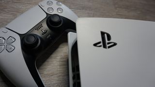 PS5 on its side with PlayStation logo, next to DualSense