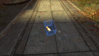 A well-loved baby doll in a milk crate in the middle of the sidewalk in Half-Life 2.