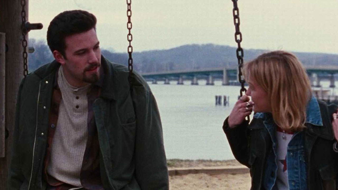 Ben Affleck and Joey Lauren Adams sitting on swings in Chasing Amy.